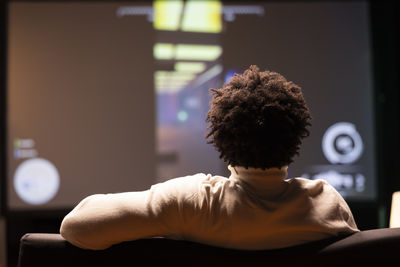 Side view of man exercising at home