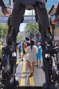 People walking on road in city