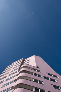 Low angle view of building against blue sky