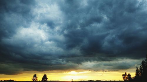 Low angle view of dramatic sky during sunset