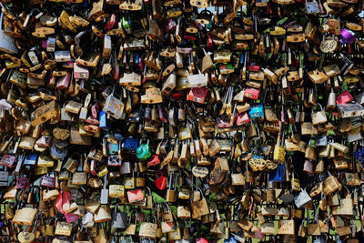 Full frame shot of padlocks hanging on metal