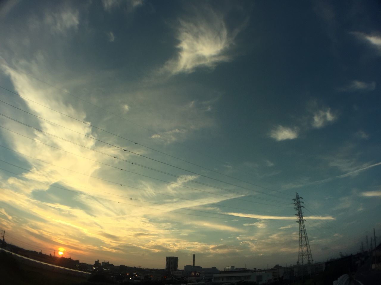 sky, architecture, built structure, sunset, city, cloud - sky, cityscape, power line, cloud, outdoors, nature, no people, scenics, cloudy, beauty in nature, cable, sun, city life, residential district, power supply, tranquility, development