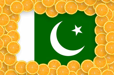 Digital composite image of orange fruit against white background