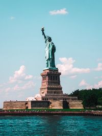 River against statue of liberty in city