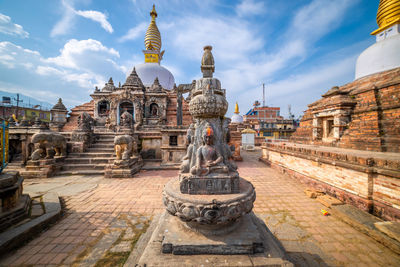 Statue of historic building against sky