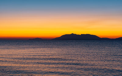 Sunrise at 6 o'clock in the morning from the beach on the mediterranean in front of kos greece