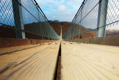 Surface level of bridge against sky