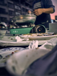 Close-up of man preparing food on table