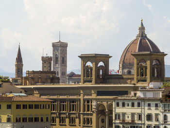 Buildings in city against sky