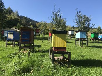 Lifeguard hut on field against sky