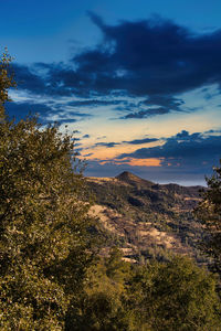 Scenic view of landscape against sky during sunset