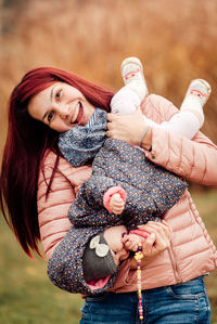 Portrait of a happy woman holding hands