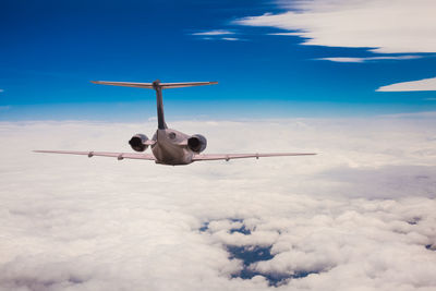 Low angle view of airplane flying in sky