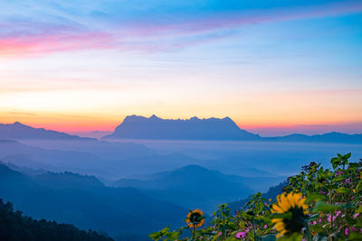 Scenic view of mountains against sky during sunset