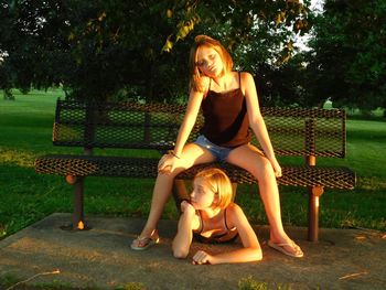 Young woman sitting in park