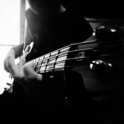 Close-up of hand playing guitar