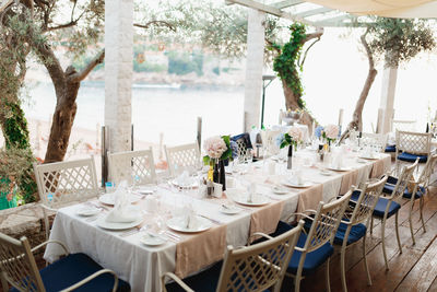 Empty chairs and tables in restaurant