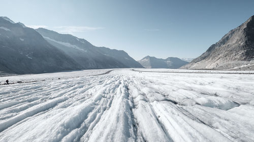 Scenic view of snow mountains against sky