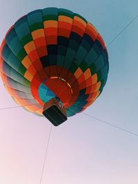 Low angle view of hot air balloons against sky