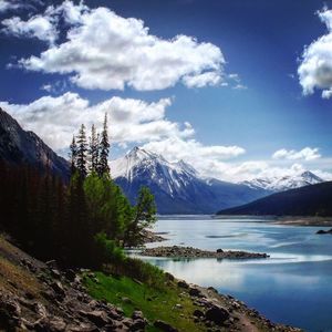 Scenic view of mountains against cloudy sky