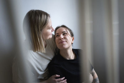 Loving young lesbian women looking at each other