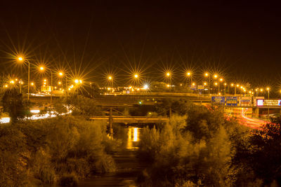 High angle view of illuminated street at night