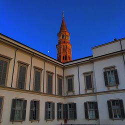 Low angle view of building against clear blue sky