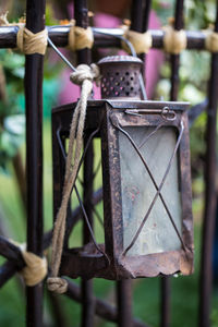 Close-up of rusty tied hanging on metal