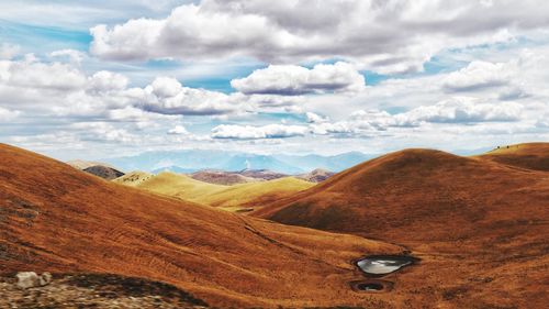 View of landscape against cloudy sky