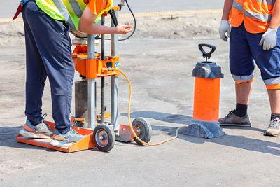 Low section of man working at construction site