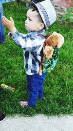 Full length of cute girl holding cat