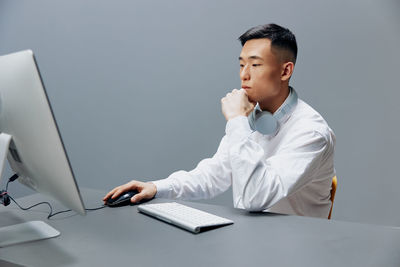 Doctor working at desk in office