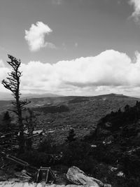 Scenic view of landscape against cloudy sky