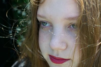 Close-up portrait of young woman