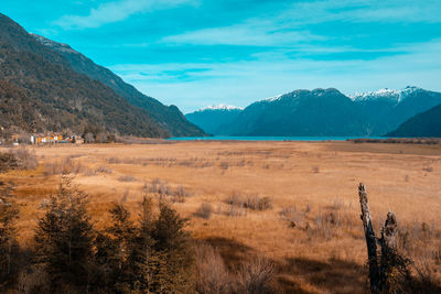 Scenic view of landscape and mountains against sky