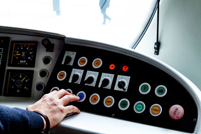 Close-up of hand holding control panel