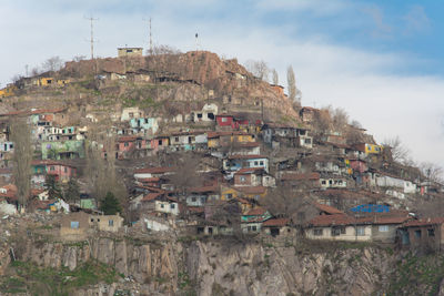 Buildings in town against sky