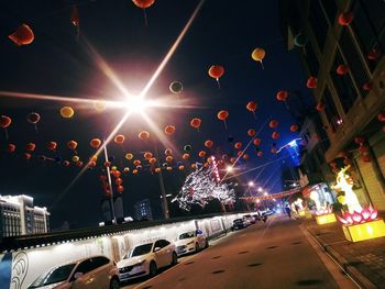 Illuminated city street at night