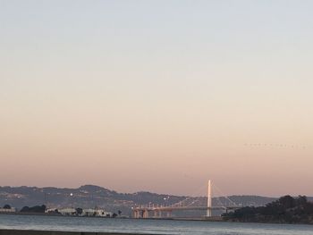 View of suspension bridge over sea