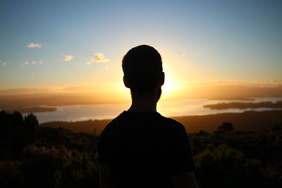 Portrait of silhouette man standing against sky during sunset