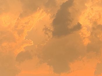 Low angle view of dramatic sky during sunset