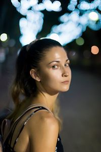 Portrait of young woman looking at camera