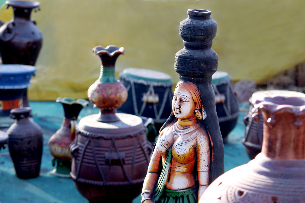 CLOSE-UP OF STATUE AT MARKET