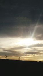 Scenic view of field against sky at sunset