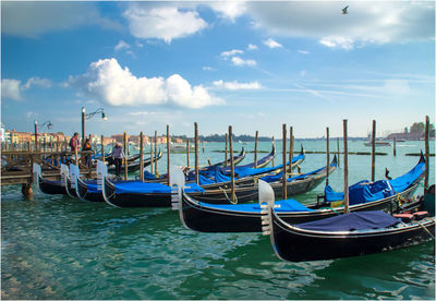 Boats moored in canal