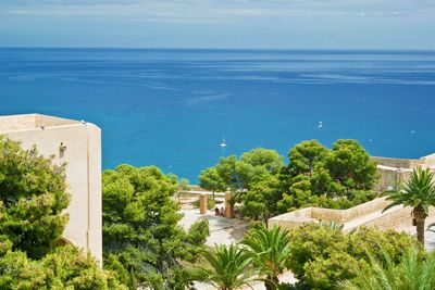High angle view of swimming pool by sea against sky