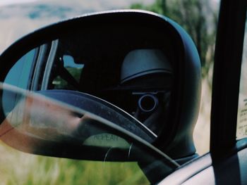 Close-up of car on side-view mirror