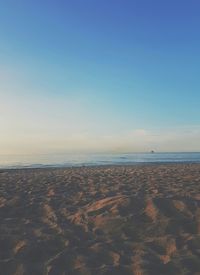 Scenic view of beach against clear sky