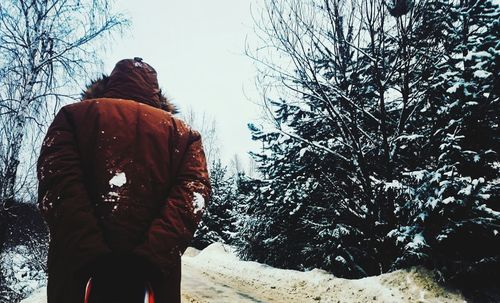 Rear view of person standing in snow