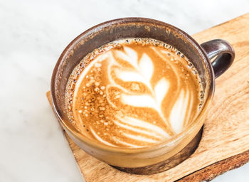 Close-up of cappuccino on table